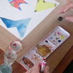 Participants work on their abstract geometric watercolour painting